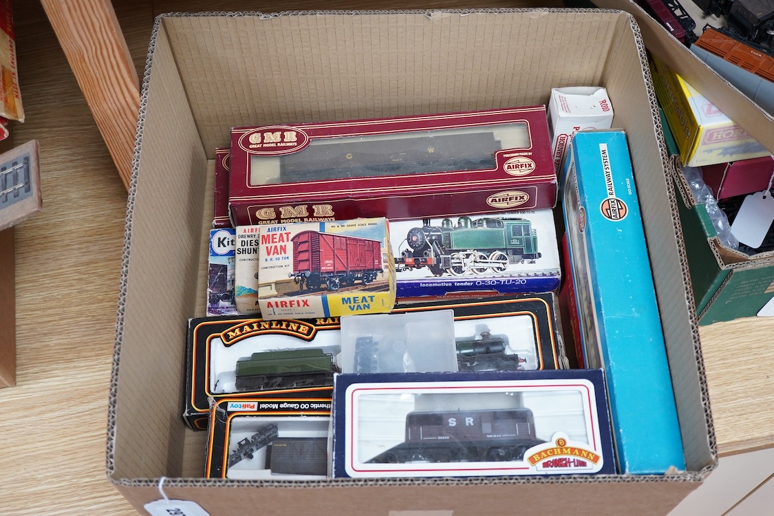 A quantity of 00 gauge railway by various makes, comprising; nine locomotives by Tri-ang, Hornby Dublo, etc. (one missing tender), sixteen maroon bogie coaches and eighteen freight wagons